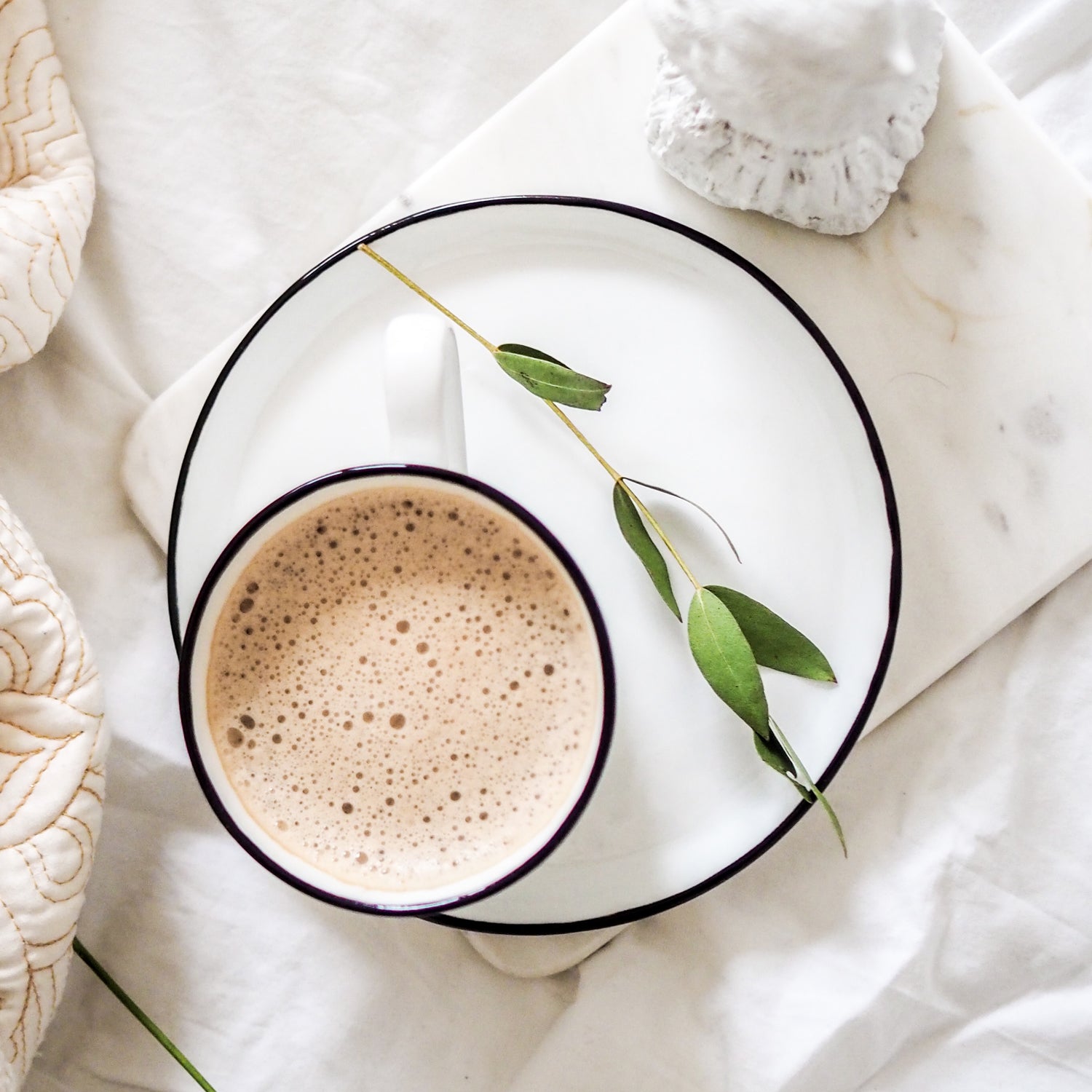 White teacup filled with coffee